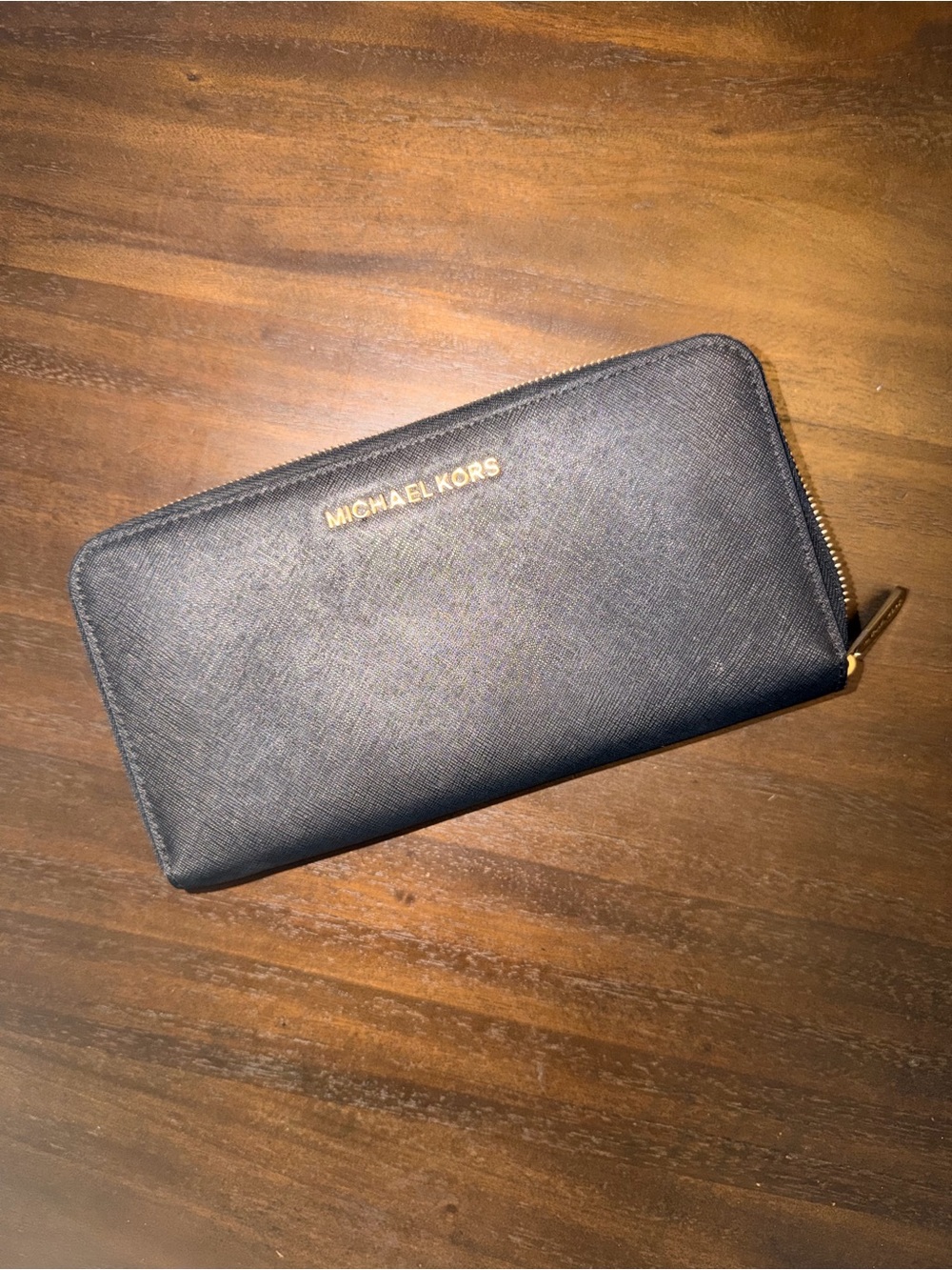 Michael Kors Black Zip Wallet with Gold Logo and gold zipper